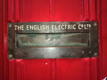 Close-up of text on red door