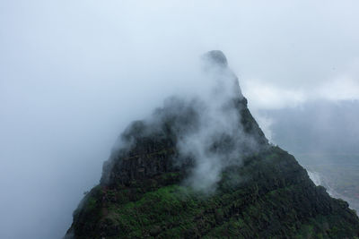 Scenic view of volcanic mountain against sky