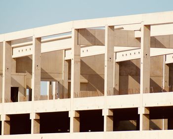 Low angle view of building against clear blue sky