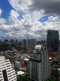 High angle view of buildings in city against sky