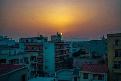 High angle view of townscape against sky during sunset