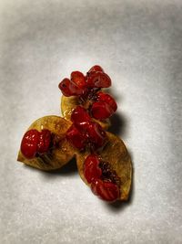 High angle view of strawberries on table against white background