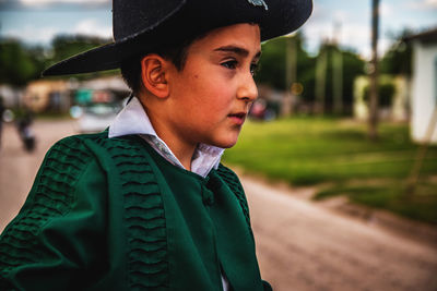 Close-up of boy wearing hat 
