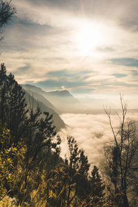 Scenic view of mountains against sky at sunset