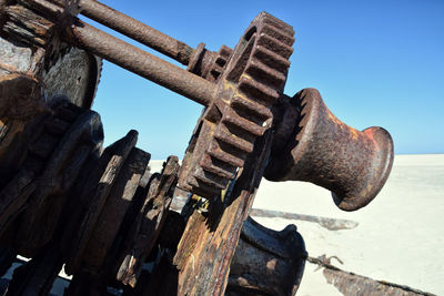 Old rusty metallic structure against sky