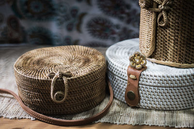 Close-up of wicker containers on table