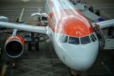 Close-up of airplane at airport runway