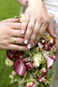 Midsection of man holding bouquet