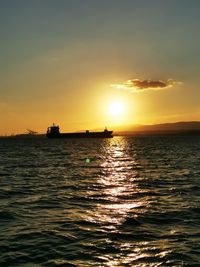 Scenic view of sea against orange sky