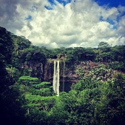 Scenic view of landscape against cloudy sky