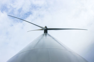 Low angle view of windmill against sky