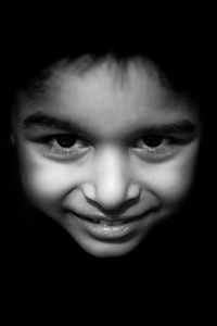 Close-up portrait of smiling mid adult man