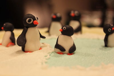 Close-up of figurines on fake snow