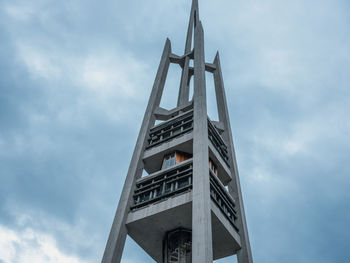 Low angle view of building against cloudy sky