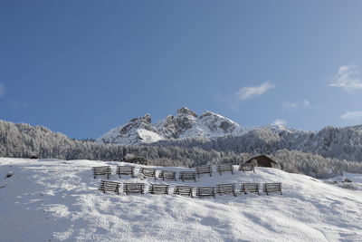 Piz tomuel or wissensteinhorn mountain and forest covered with snow seen from vals in switzerland.