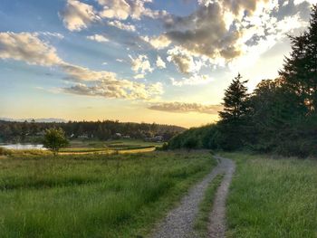 Scenic view of land against sky during sunset