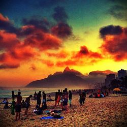 People on beach at sunset