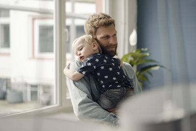 Father spending time with his son at home