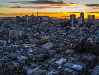 Aerial view of cityscape during sunset