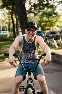 Portrait of smiling man riding bicycle