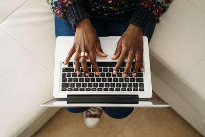 Young businesswoman working on laptop at home