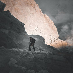 High angle view of man climbing on mountain