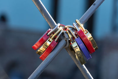 Close-up of padlocks on railing