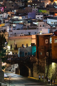 High angle view of buildings in city at night