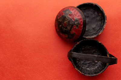 Directly above shot of baskets on red background