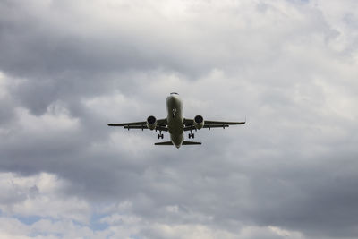 Low angle view of airplane against sky