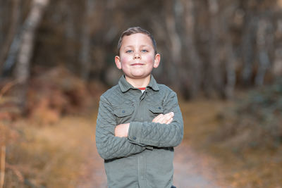 Portrait of boy standing outdoors