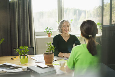 Smiling businesswoman during a meeting in office