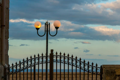 Street light against sky during sunset