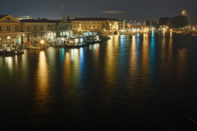 Reflection of illuminated buildings in water at night