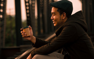 Side view of young man looking away