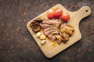 High angle view of bread on cutting board