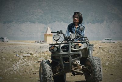 Portrait of smiling man riding motorcycle