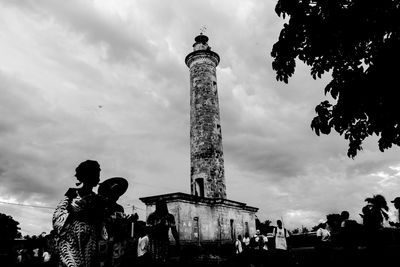 Low angle view of statue against cloudy sky