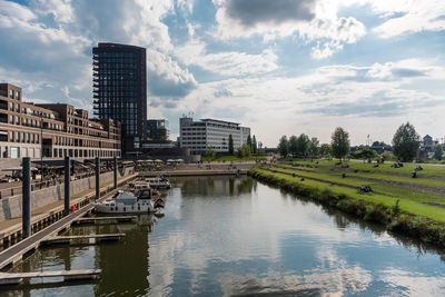 River in city against sky