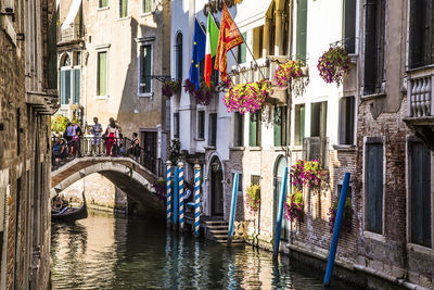 Canal amidst buildings in city