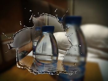 Close-up of glass bottle on table