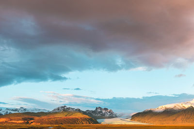 Scenic view of snowcapped mountains against sky