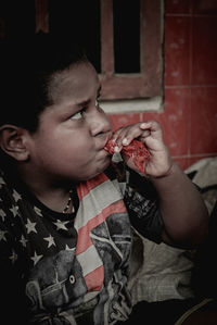 Portrait of boy eating food