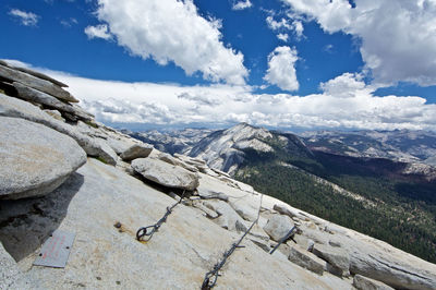 Scenic view of mountains against cloudy sky