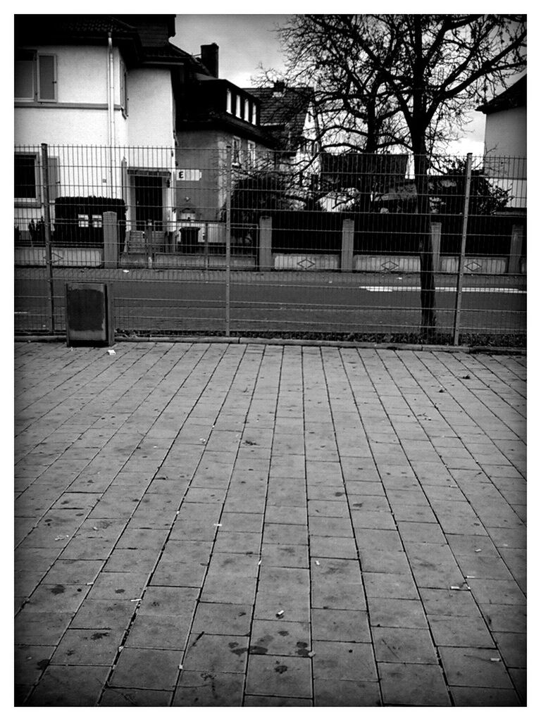 transfer print, building exterior, architecture, built structure, auto post production filter, city, cobblestone, building, sidewalk, street, residential structure, residential building, tree, house, outdoors, day, empty, footpath, paving stone, sunlight