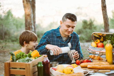 Side view of senior man preparing food at farm