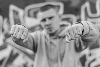 Close-up of boy with tattoo on hand