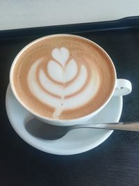 Close-up of cappuccino on table
