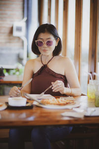 Portrait of woman sitting at table