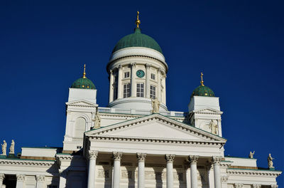 Low angle view of building against blue sky